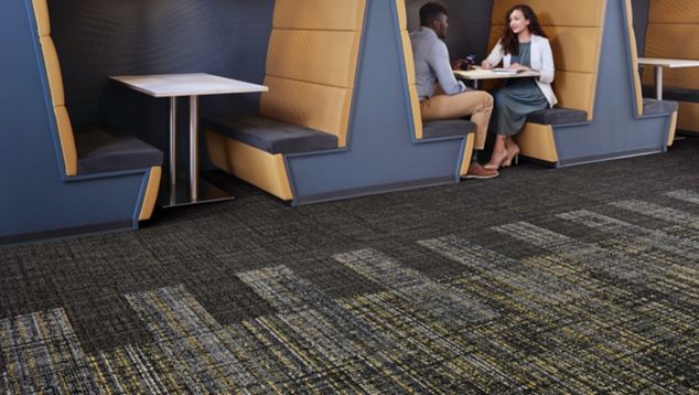 Interface Source Material and Upload plank carpet tile in a common space with booths 